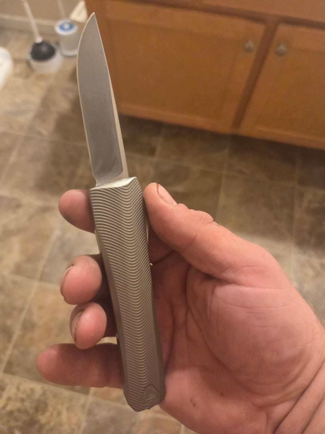 Customer photo review of Core Edge USA 0331 Pulsar OTF Auto Knife - Natural Aluminum, 3.35" MagnaCut Drop Point, Single Edge - Made in USA (CE-0331-PULSAR-NAT-SE)