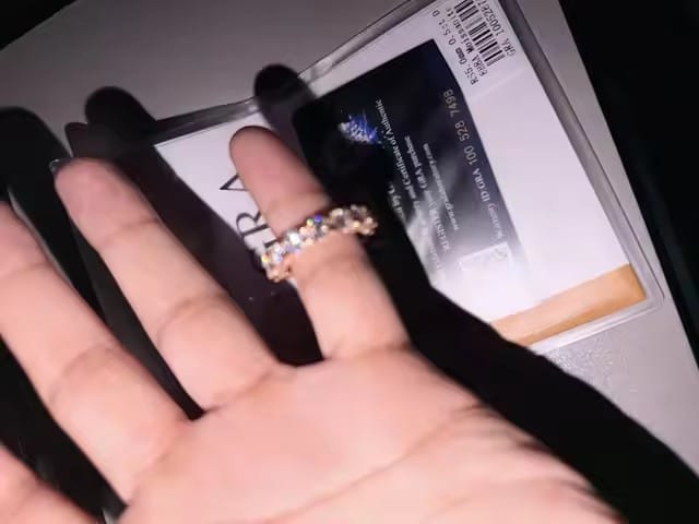 Customer photo review of 50 Pointer Round Mix Pear Cut Side Iced Eternity Ring Moissanite