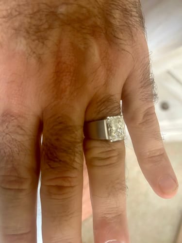 Customer's Radiant Brilliant Diamond Men's Ring worn on a hand, showing a large radiant-cut diamond.
