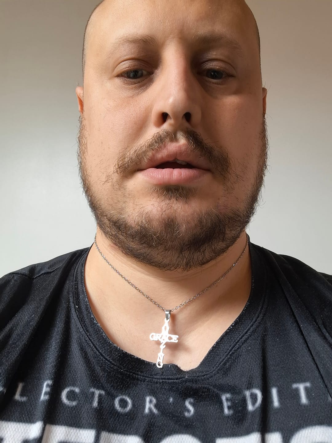 Customer photo review of Christianartworkshop AMAZING GRACE Cross Necklace: A Testament of Divine Love
