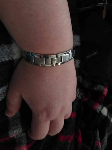 Customer's Iron Man Armor Titanium Magnetic Bracelet worn on their wrist, showing the metallic link design.