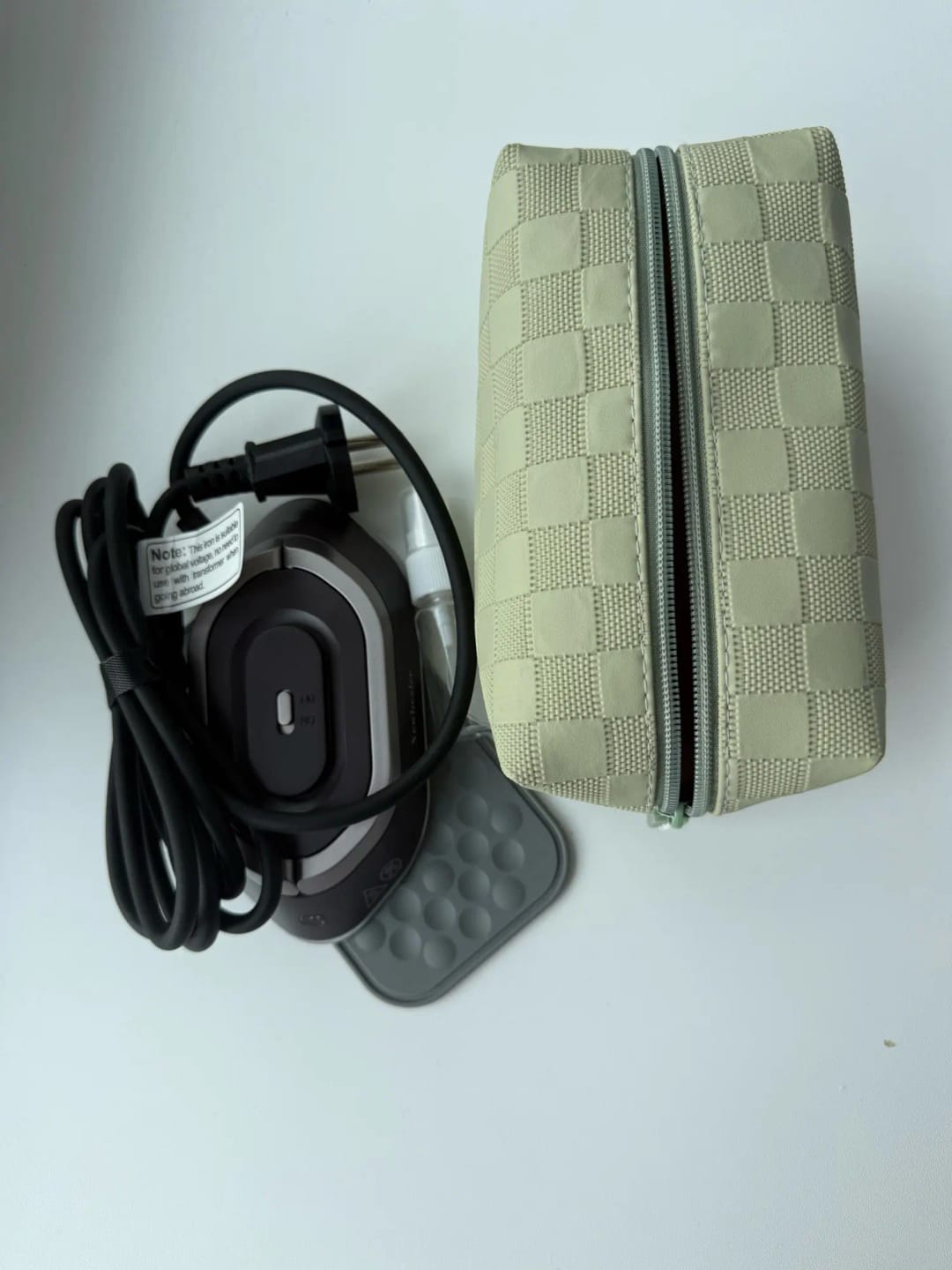 Customer photo review of THE MINI TRAVEL IRON PACK LIGHT. LOOK SHARP.