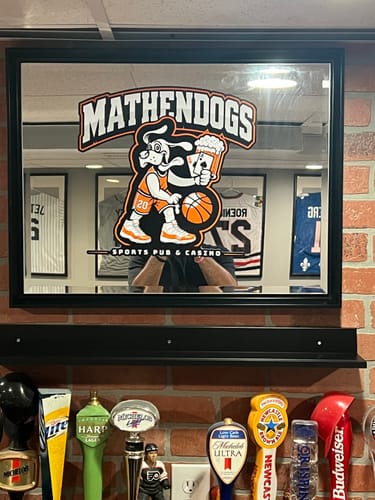 Customer's custom die cut decal applied to a mirror, featuring a dog cartoon design.