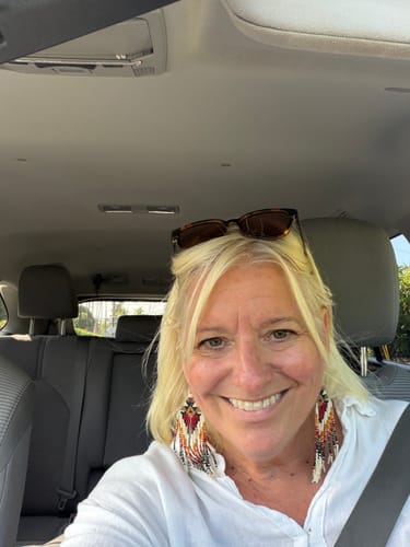 Customer's selfie taken in a car, showing the results of using The Micro Infusion System.