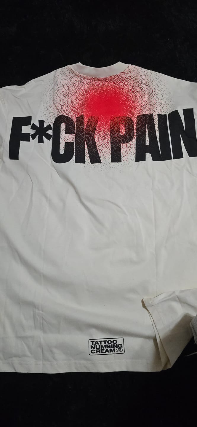 Customer photo review of F*CK PAIN Merch Bundle — Oversized Tee + Distressed Camo Cap