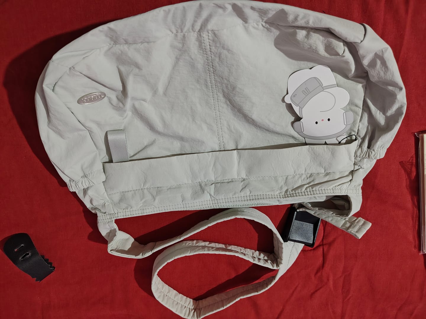 Customer photo review of MERCI CHARM CROSS BAG (GRAY)