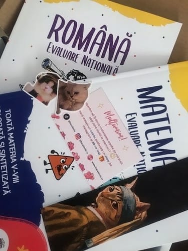 Customer's Pachet Evaluare Națională Bacademia, including Română and Matematică study books with decorative stickers.