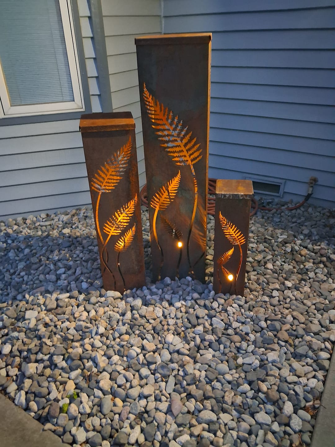 Customer photo review of Fern with Stem Garden Columns  – Metal Outdoor Sculpture & Well Cover – Rustic Steel Garden Decor