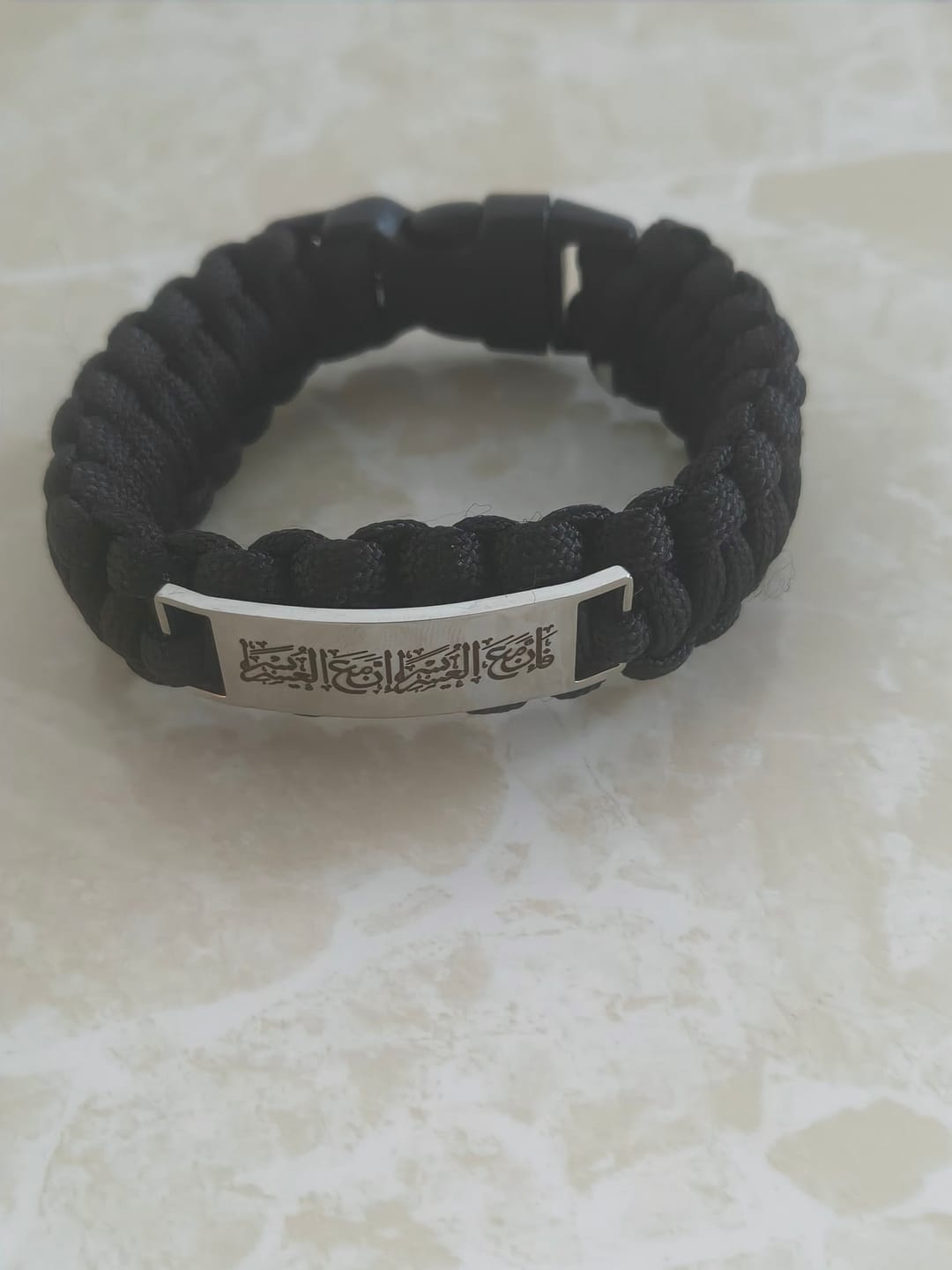 Customer photo review of Hilalhaven Braided Oath "indeed, With Hardship Comes Ease" Engraved Paracord Unisex Bracelet