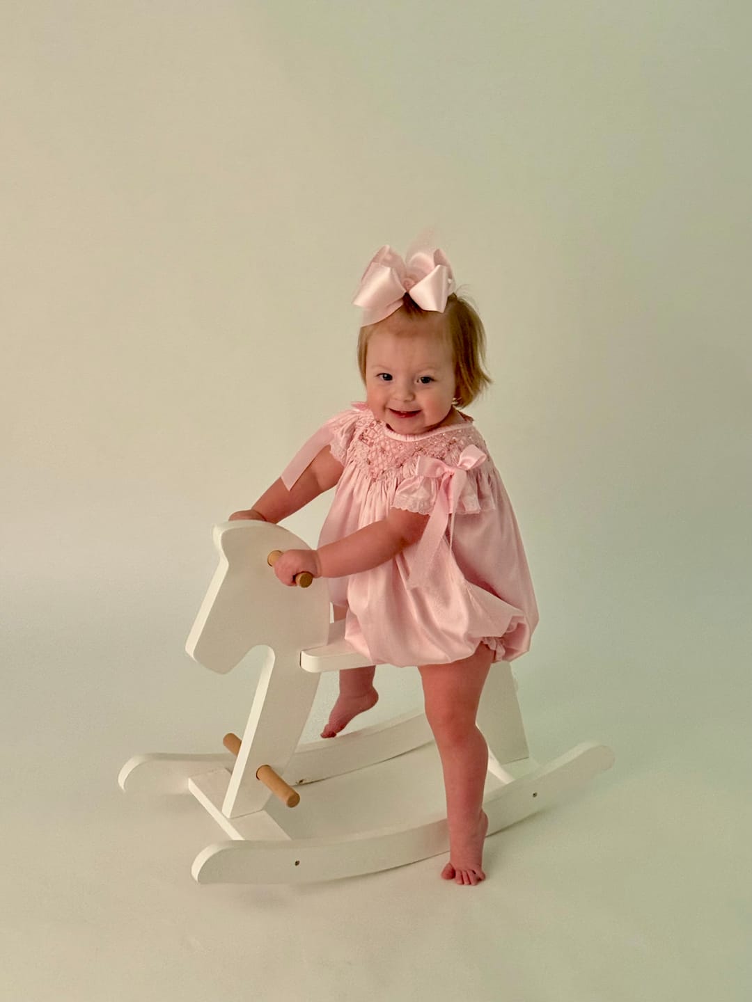 Customer photo review of Pink Satin Rosette & Pearls Smocked Bishop Bubble