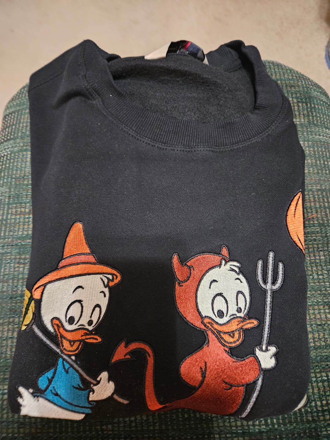 Customer photo review of Disney "Tricks, Treats, and Trouble" – Crewneck Sweatshirt