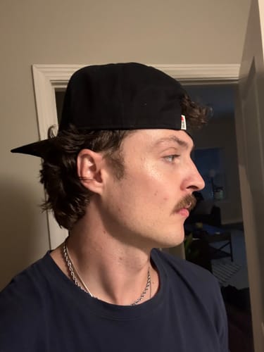 Customer's Big Structured A-Frame Hat worn from the side profile by a person.