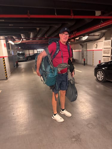 Customer's Aleader Xdrain Crew shoes worn while carrying travel gear in a parking garage.
