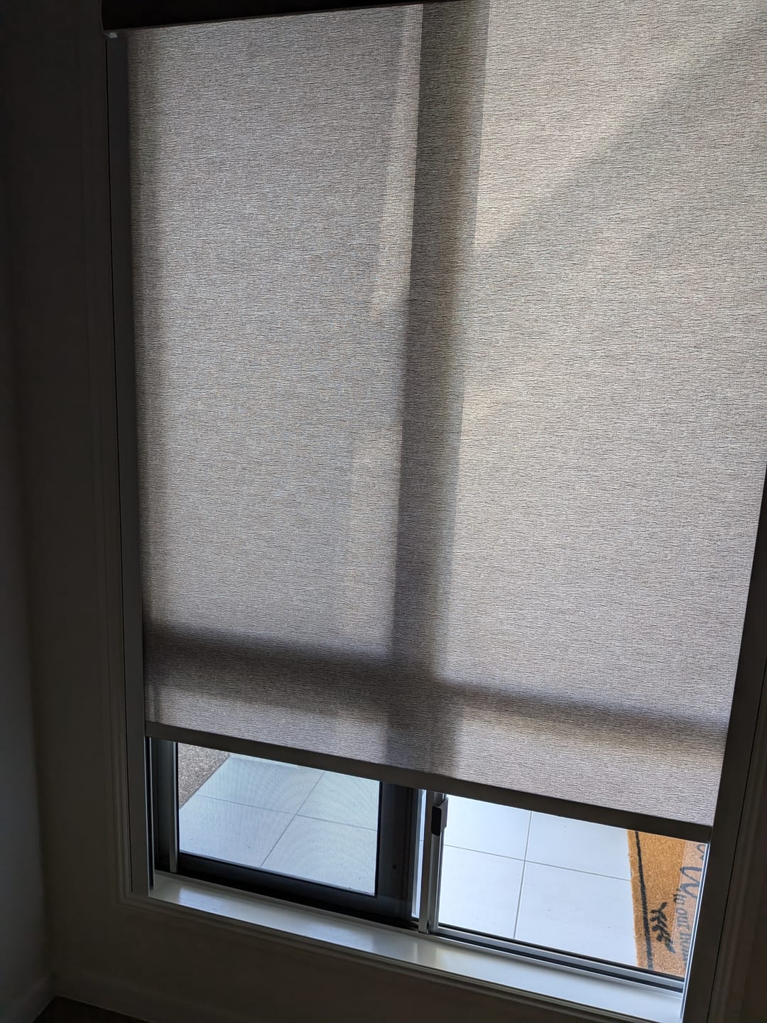 Customer photo review of SmartWings Motorized Light Filtering Roller Shades 70% Blackout Safari