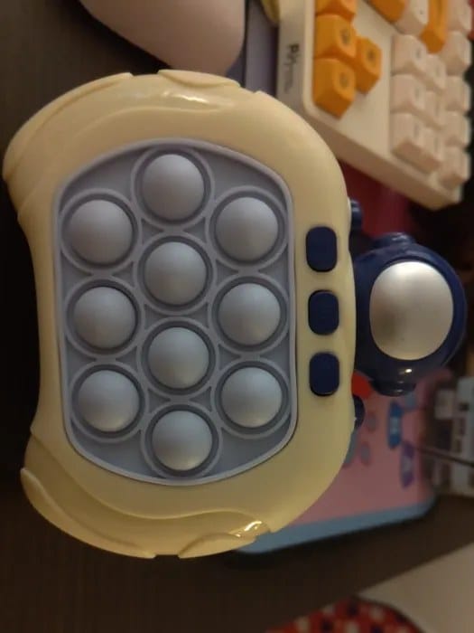 Customer photo review of Pop It Reaktionsspiel Handkonsole | Geschicklichkeitsspiel Kinder Reflextraining Tiermotiv