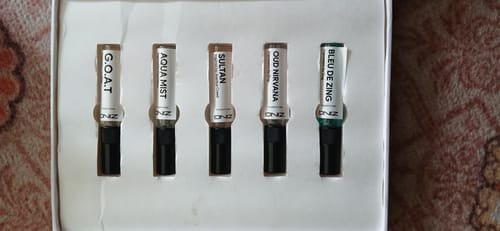 Customer's Make Your Own Tester Pack showing five small perfume bottles in a white display box.