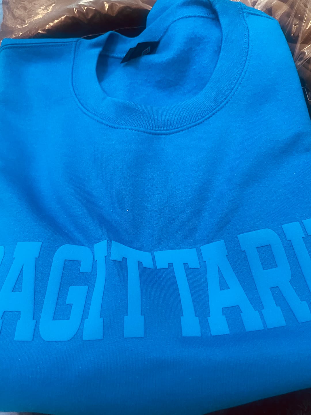 Customer photo review of Royal Blue Zodiac Puff Print Crewneck