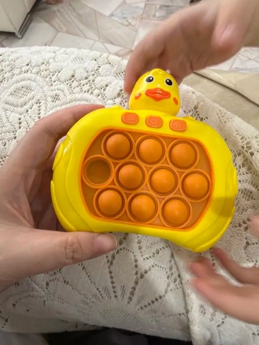 Customer photo review of Pop It Reaktionsspiel Handkonsole | Geschicklichkeitsspiel Kinder Reflextraining Tiermotiv