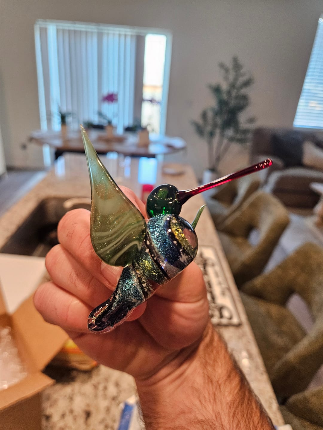 Customer photo review of Dichroic Twist Glass Hummingbird with Infused Ash