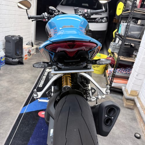 Customer's Triumph Speed Triple 1200 RS tail tidy installed, viewed from directly behind the motorcycle.
