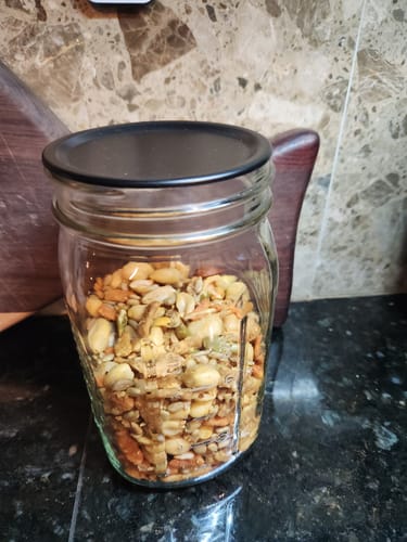 Customer's Mason Genie Vacuum Sealer Kit, showing a clear glass jar filled with mixed nuts and a black lid.