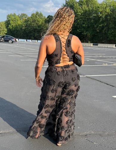 Reviewer's black Floral Appliqué Lace Crop Top featuring an open lace-up back design.