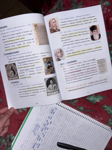 Reviewer's Pachet Bacalaureat book open to history page with colored text and portraits, beside a notebook and pen.