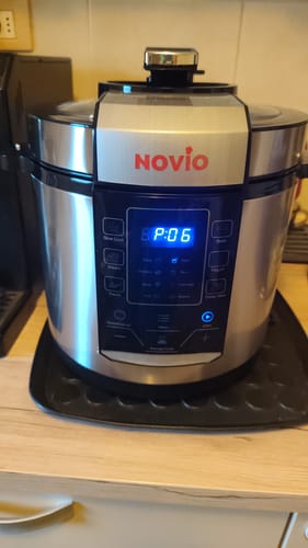 Customer's Novio SteelCook multicooker on a kitchen counter with the digital display showing a glowing P:06 setting.
