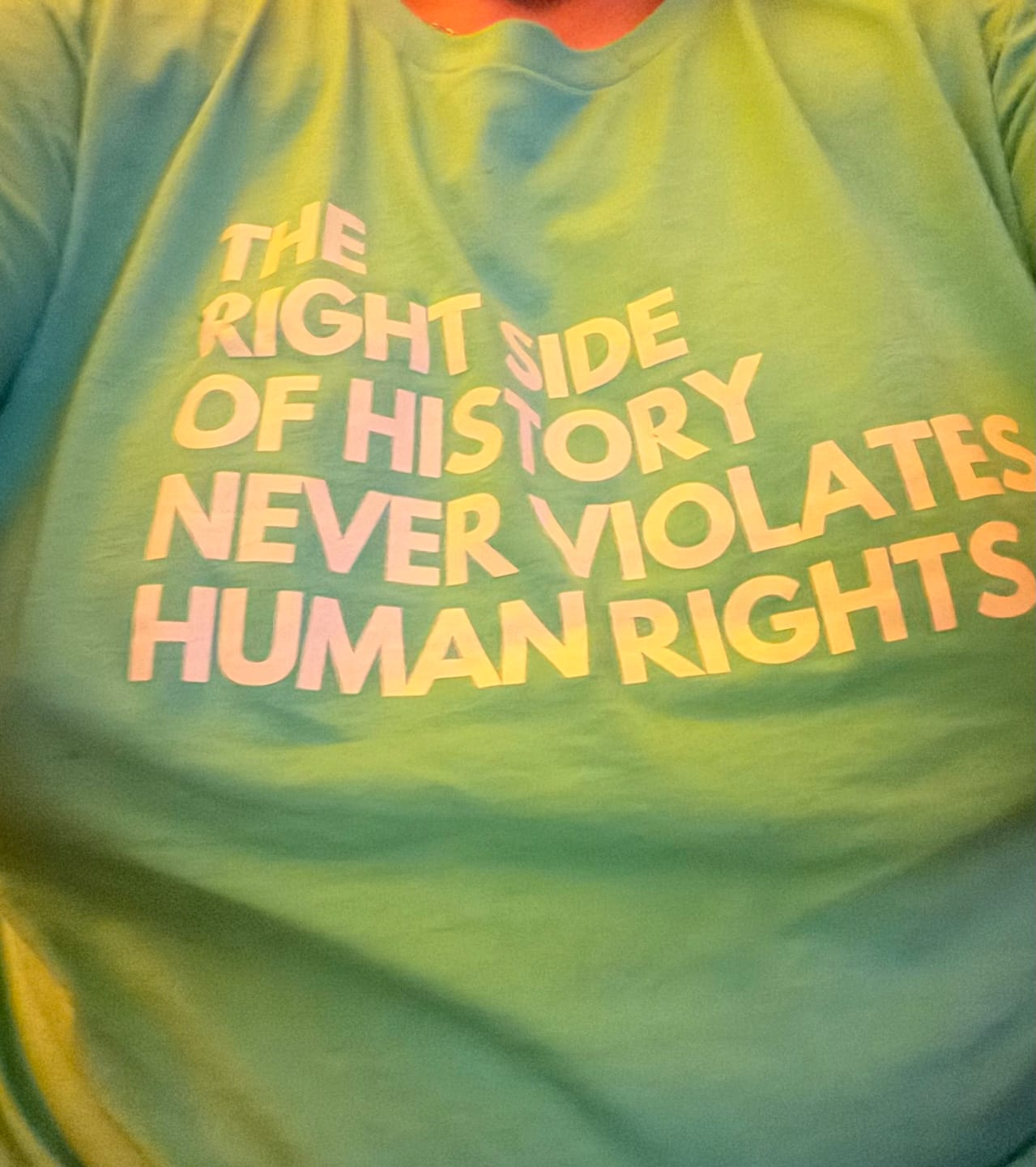 Customer photo review of Love is Not the Threat Pride Remix Unisex T-Shirt