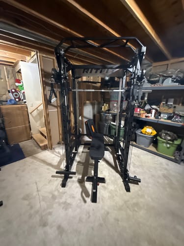 Customer's P9 squat rack with pulley system and bench assembled in a basement.