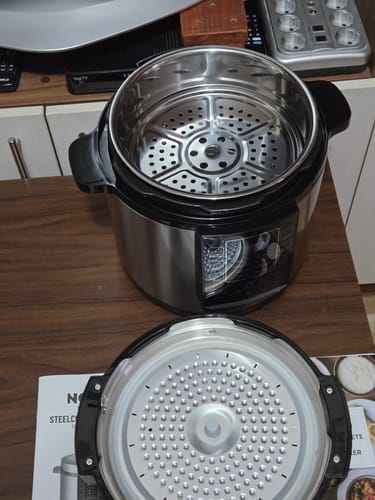 Customer's Novio SteelCook multicooker with the lid removed, revealing the metallic inner pot and steam rack.