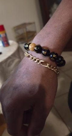 Customer photo review of FuAttract Protection Guardian & Buddhist Blessings Gold Foil Om Mani Mantra Black Onyx Energy Bracelet