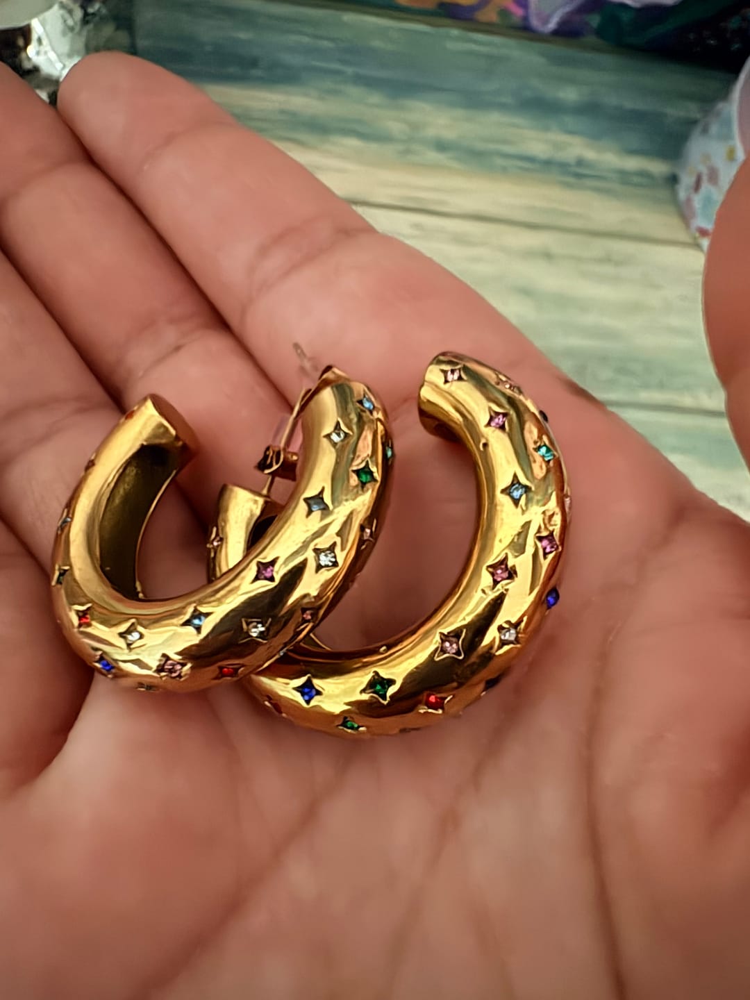 Customer photo review of Petra Gold Rainbow Chunky Star Hoops
