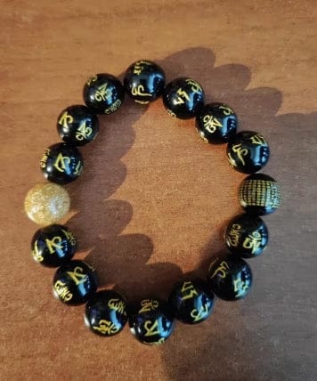 Customer photo review of FuAttract Protection Guardian & Buddhist Blessings Gold Foil Om Mani Mantra Black Onyx Energy Bracelet