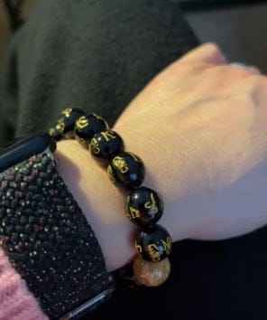 Customer photo review of FuAttract Protection Guardian & Buddhist Blessings Gold Foil Om Mani Mantra Black Onyx Energy Bracelet