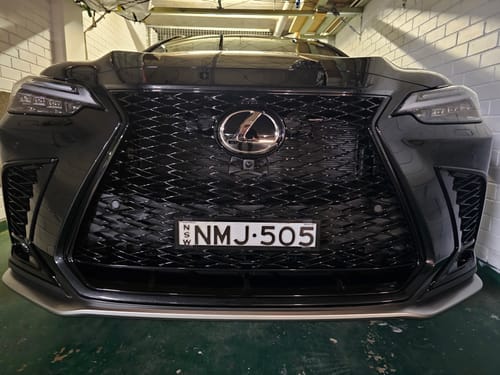 Customer's sleek black slimline number plate bracket mounted on the front of a Lexus vehicle.