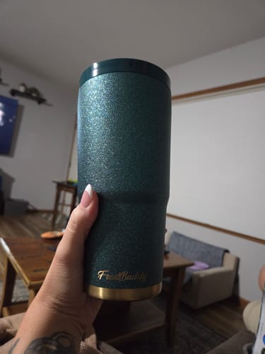 Reviewer's emerald glitz To-Go Buddy tumbler held in hand