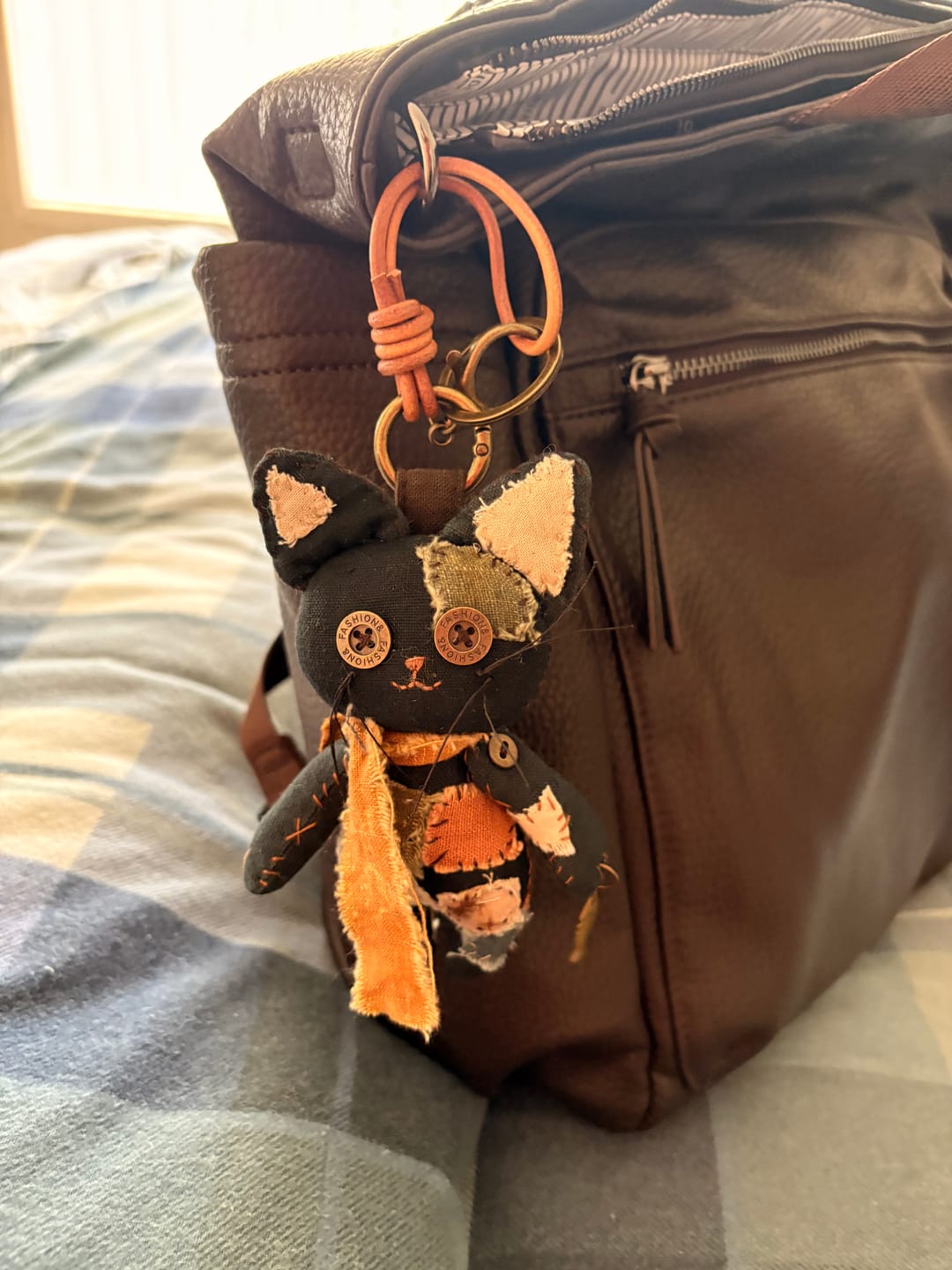 Customer photo review of Patched Black Cat — Handmade Bag Charm