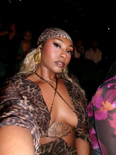Reviewer's leopard print Chiffon Head Scarf worn tied securely around the head, seen from a high angle.