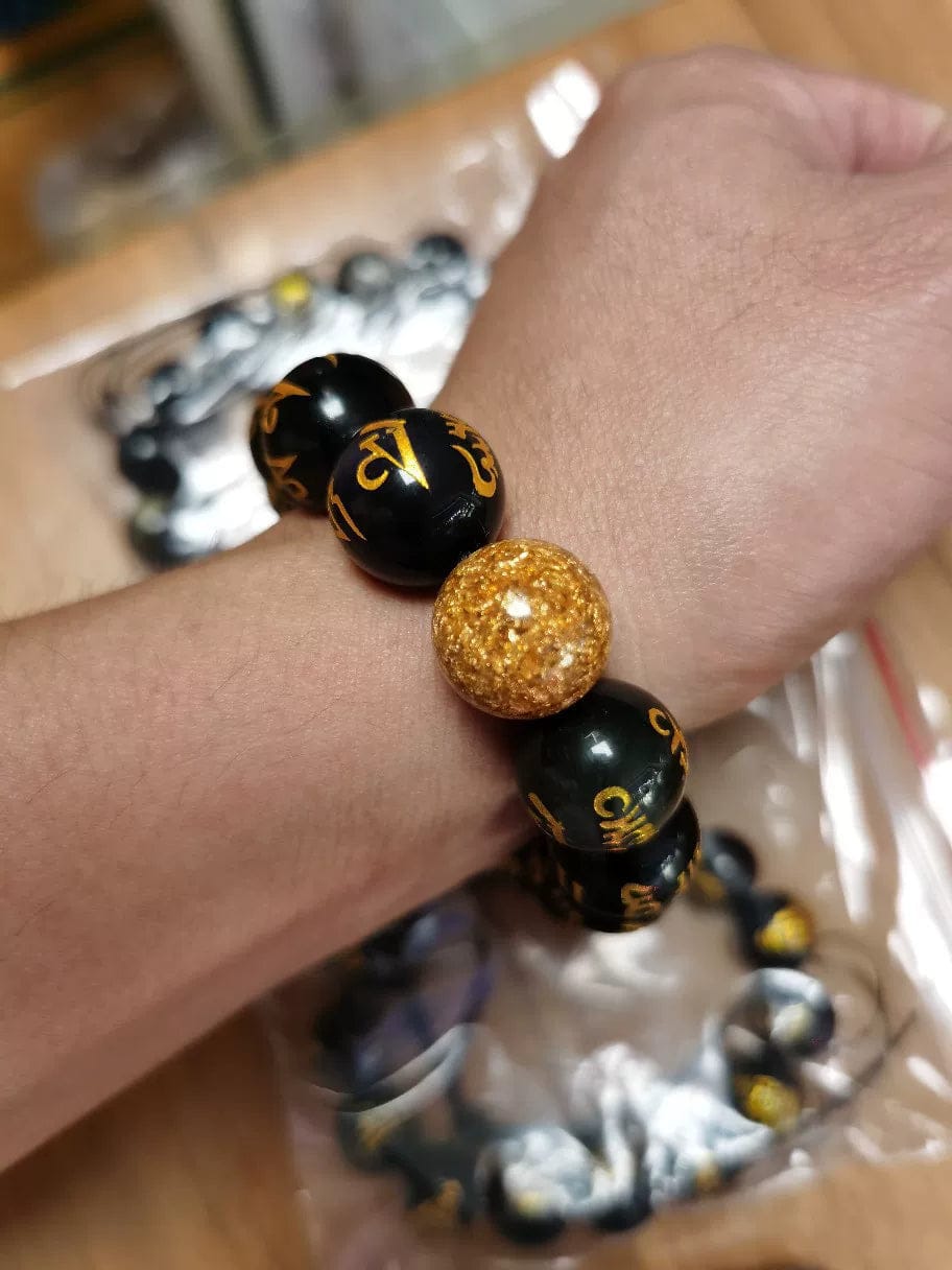 Customer photo review of FuAttract Protection Guardian & Buddhist Blessings Gold Foil Om Mani Mantra Black Onyx Energy Bracelet