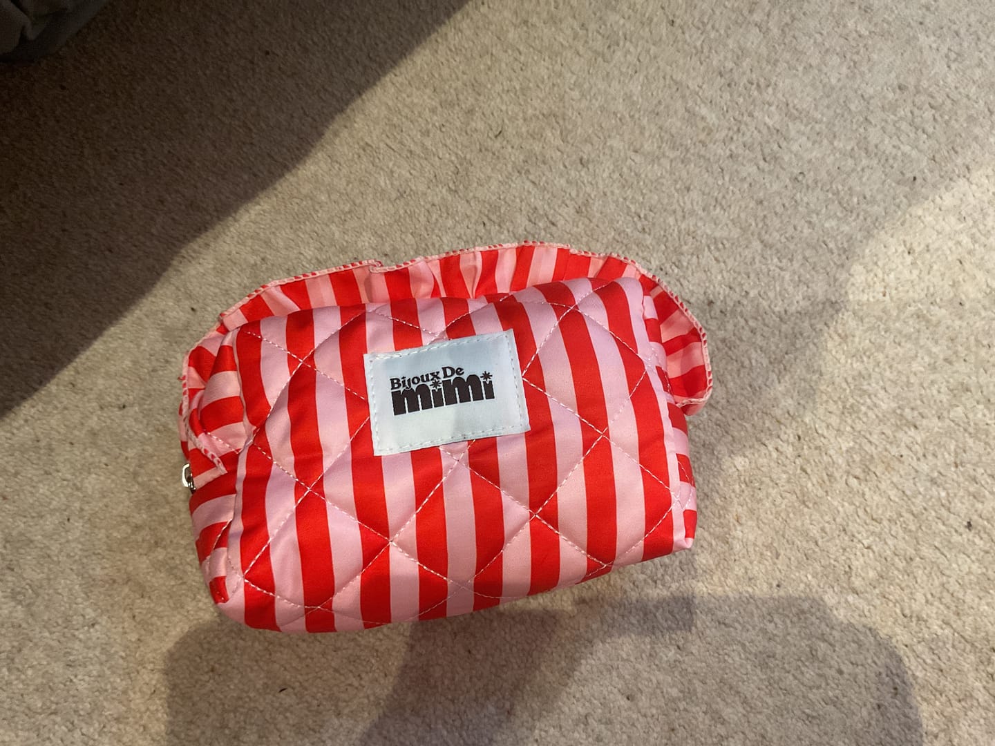 Customer photo review of Stripe Ruffle Pouch