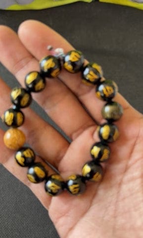 Customer photo review of FuAttract Protection Guardian & Buddhist Blessings Gold Foil Om Mani Mantra Black Onyx Energy Bracelet