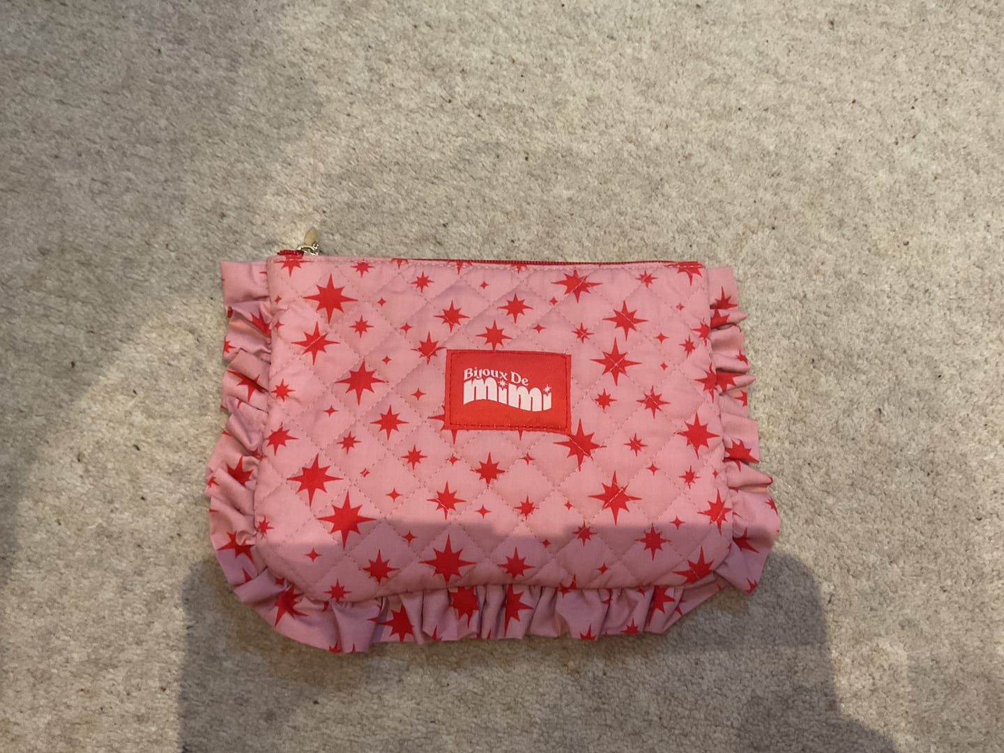 Customer photo review of Pink Star Ruffle Pouch