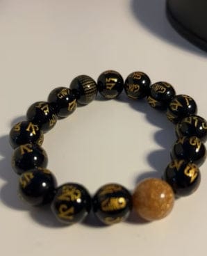Customer photo review of FuAttract Protection Guardian & Buddhist Blessings Gold Foil Om Mani Mantra Black Onyx Energy Bracelet