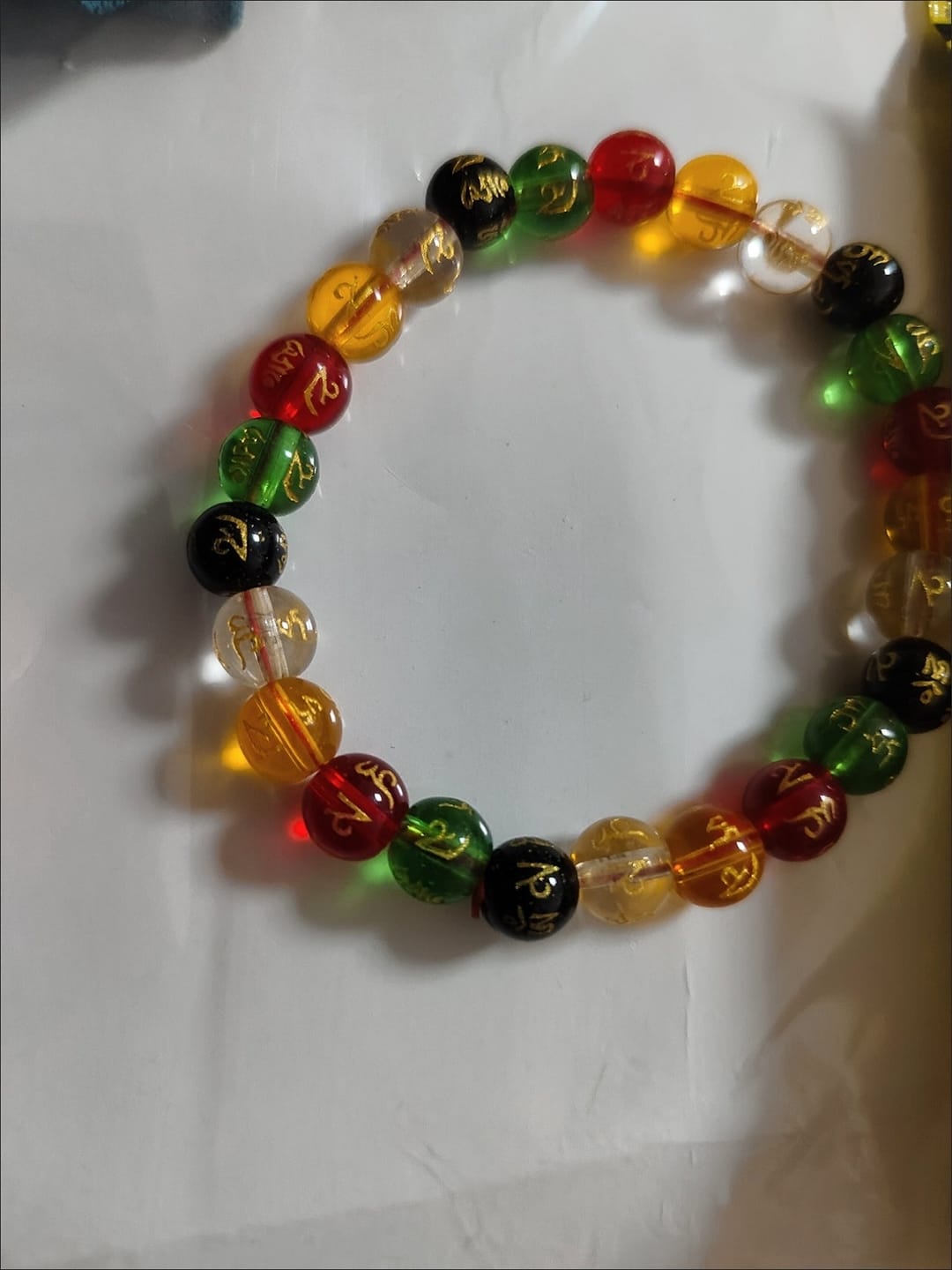 Customer photo review of FREE Today: Protection Harmony & Good Luck Om Mani Mantra Gold Foil Engraved Colorful Glaze Bracelet