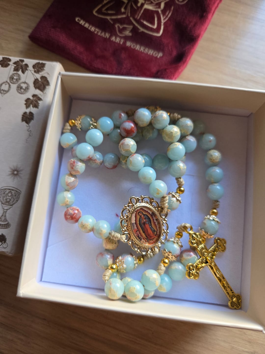 Customer photo review of Christianartworkshop Aqua Stone Prayer Rosary with Gold Accents: A Divine Source of Peace and Devotion