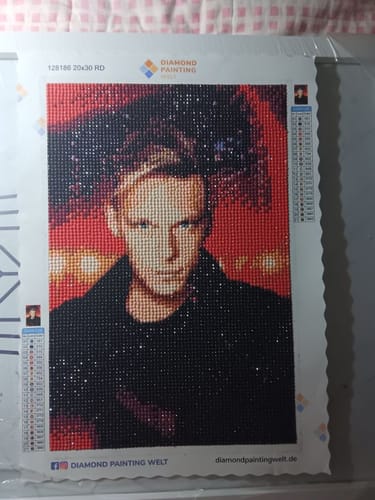 Customer's Diamond Painting eigenes Bild showing a portrait of a person in red and dark tones with color codes.