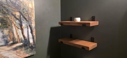 Customer photo review of Reclaimed-Style Solid Wood Floating Shelf with Black Metal Brackets, Rustic Wall Storage