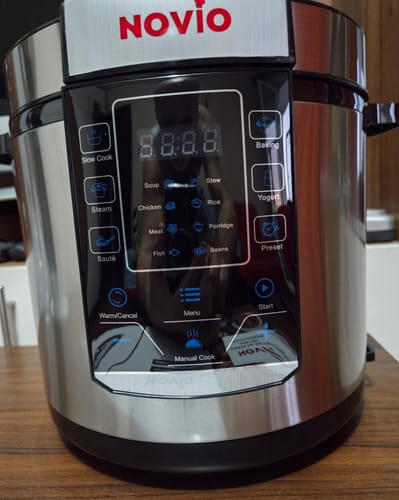 Customer's Novio SteelCook multicooker, showing the digital control panel with preset cooking options.