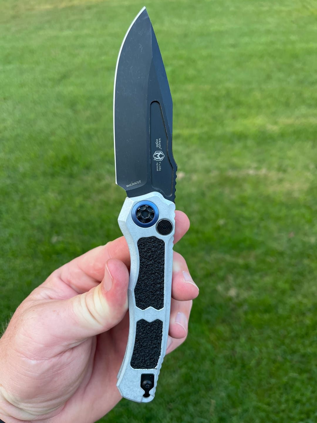 Customer photo review of Heretic Knives Wraith V4 SE Auto Knife – 3.7” MagnaCut Blade, Blizzard Chassis, Battleworn Black – Made in USA